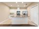 Well-lit kitchen with white cabinets, stainless steel appliances, and a granite island countertop at 11936 82Nd E St, Parrish, FL 34219