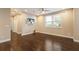 Spacious living room with hardwood floors and a ceiling fan at 11936 82Nd E St, Parrish, FL 34219