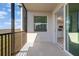 A view from the screened balcony showcases the kitchen and golf course at 12180 Wellen Golf St # 302, Venice, FL 34293