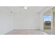 Bright, minimalist bedroom with sliding glass doors leading to a balcony at 12180 Wellen Golf St # 302, Venice, FL 34293