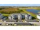 Exterior of condo building and parking at 12180 Wellen Golf St # 302, Venice, FL 34293
