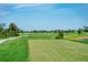 Golf course tee box with lush green fairways at 12180 Wellen Golf St # 302, Venice, FL 34293