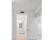 Bright hallway with white doors and trim, leads to a bathroom, enhancing the home's appeal at 12180 Wellen Golf St # 302, Venice, FL 34293