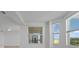 Bright living area with views from a window and a balcony over a golf course at 12180 Wellen Golf St # 302, Venice, FL 34293