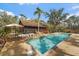 Pool view featuring a pool deck and a view of the house and surrounding trees at 13600 N Branch Rd, Sarasota, FL 34240