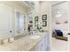 Modern bathroom featuring a granite countertop vanity with a sink and decorative mirror at 14210 9Th Ne Ter, Bradenton, FL 34212