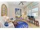 Coastal-themed room featuring nautical decor, comfortable seating, and natural light from large windows at 14210 9Th Ne Ter, Bradenton, FL 34212