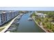 Aerial view of a waterfront apartment building showing boat docks and waterway access for residents at 1709 N Tamiami Trl # 422, Sarasota, FL 34234