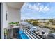 Outdoor bar area with a mini fridge and a view of the waterway with boats docked in the background at 1709 N Tamiami Trl # 422, Sarasota, FL 34234