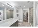 Well-lit bathroom featuring a glass-enclosed shower and modern fixtures at 1709 N Tamiami Trl # 422, Sarasota, FL 34234