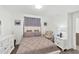 Comfortable bedroom featuring a queen-size bed, soft lighting, and tasteful decor at 1709 N Tamiami Trl # 422, Sarasota, FL 34234