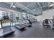 Well-equipped gym featuring state-of-the-art treadmills and fitness equipment with view of the pool at 1709 N Tamiami Trl # 422, Sarasota, FL 34234