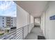 Hallway outside condo unit with view of the community at 1709 N Tamiami Trl # 422, Sarasota, FL 34234