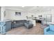 Bright, open living space with kitchen and stylish furniture, perfect for relaxation and entertaining at 1709 N Tamiami Trl # 422, Sarasota, FL 34234