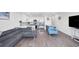 Cozy living room featuring an open concept layout and modern kitchen at 1709 N Tamiami Trl # 422, Sarasota, FL 34234
