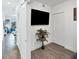 Bright room with closet, television, and sliding glass door leading to balcony at 1709 N Tamiami Trl # 422, Sarasota, FL 34234