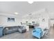 Open living space with modern kitchen, stylish furnishings, and laminate flooring at 1709 N Tamiami Trl # 422, Sarasota, FL 34234