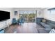 Living room with stylish furniture and balcony at 1709 N Tamiami Trl # 422, Sarasota, FL 34234