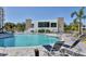Community pool with sundeck and chairs at 1709 N Tamiami Trl # 422, Sarasota, FL 34234