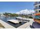 Picturesque community waterfront access with dock, lush landscaping and serene water views at 1709 N Tamiami Trl # 422, Sarasota, FL 34234