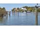 Beautiful waterfront view showcasing a dock and boat, offering a serene and picturesque living experience at 1709 N Tamiami Trl # 422, Sarasota, FL 34234