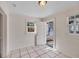 Bright mudroom with tile floor, painted wood walls, and access to the exterior at 1744 South Dr, Sarasota, FL 34239