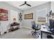 Comfortable bedroom with neutral colors, large windows, and stylish decor, perfect for relaxation or work at 17842 Cherished Loop, Bradenton, FL 34211
