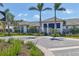 Beautiful clubhouse entrance with elegant stone and lush landscaping at 17842 Cherished Loop, Bradenton, FL 34211