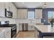 Modern kitchen equipped with stainless steel appliances, stylish backsplash, and functional countertops at 17842 Cherished Loop, Bradenton, FL 34211