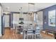 Bright kitchen boasts an island, modern lighting, stainless appliances, and eat-in dining at 17842 Cherished Loop, Bradenton, FL 34211