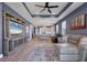 Spacious living room features an entertainment center, and flows into the kitchen for seamless living at 17842 Cherished Loop, Bradenton, FL 34211