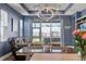 Comfortable living room boasts patio access, tray ceiling, and modern lighting for a great entertaining space at 17842 Cherished Loop, Bradenton, FL 34211