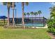 Outdoor pickleball court surrounded by palm trees, offering a fun recreational amenity for residents at 17842 Cherished Loop, Bradenton, FL 34211