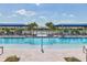 Sparkling pool with lounge chairs and views of the lake at 17842 Cherished Loop, Bradenton, FL 34211