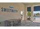Relaxing table and chair setup next to Sweetwater clubhouse pool at 17842 Cherished Loop, Bradenton, FL 34211