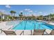 Relaxing pool area featuring lounge chairs and a clear blue pool perfect for community enjoyment and relaxation at 17842 Cherished Loop, Bradenton, FL 34211