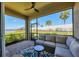 Inviting screened lanai with comfortable seating and a view of the landscaped backyard and serene pond at 17842 Cherished Loop, Bradenton, FL 34211