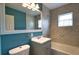 Bathroom featuring tub, tiled shower, vanity, toilet, and mirror at 221 Laurel E Rd, Nokomis, FL 34275