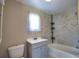 Bathroom featuring tub with tiled shower, vanity, and toilet at 221 Laurel E Rd, Nokomis, FL 34275