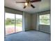 Bedroom featuring large windows, ceiling fan, and lake view at 221 Laurel E Rd, Nokomis, FL 34275