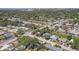 Expansive aerial view of a residential neighborhood, showcasing lush greenery and various single-Gathering homes at 2412 Grove St, Sarasota, FL 34239