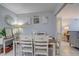 Cozy dining room with decorative wall art and seamless flow into the living area at 2412 Grove St, Sarasota, FL 34239
