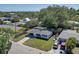 Lovely single-story home with a long driveway, charming curb appeal, and plenty of green space at 2412 Grove St, Sarasota, FL 34239