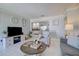 Comfortable living room showcasing an open floor plan to the dining area and beyond at 2412 Grove St, Sarasota, FL 34239