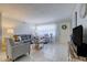 Inviting living room featuring tile floors, comfortable seating, and bright natural light at 2412 Grove St, Sarasota, FL 34239
