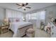 Comfortable bedroom with neutral walls, wooden bed frame, and side tables at 2412 Grove St, Sarasota, FL 34239