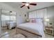 Relaxing bedroom design featuring neutral colored walls, plush pillows, and a mirrored closet at 2412 Grove St, Sarasota, FL 34239