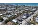 Aerial view of the neighborhood featuring many different single Gathering homes and a view of the beach in the distance at 313 Magnolia Ave, Anna Maria, FL 34216