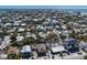 Aerial view of the neighborhood featuring many different single Gathering homes and a view of the beach in the distance at 313 Magnolia Ave, Anna Maria, FL 34216