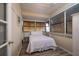 Bright bedroom with white bedding, windows, and plenty of natural light at 313 Magnolia Ave, Anna Maria, FL 34216
